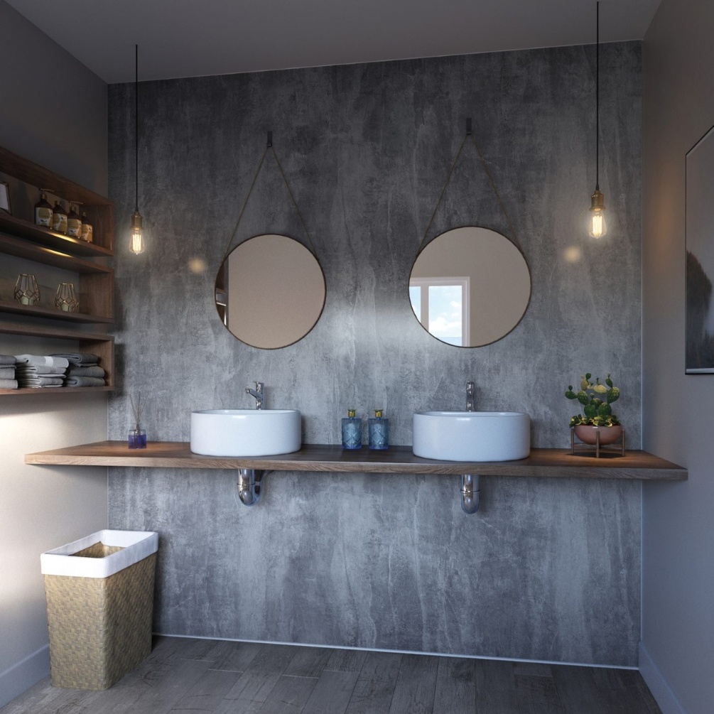Lifestyle image of the Showerwall Laminate Washed Charcoal 2440mm x 579mm Proclick MDF Wall Panel - SW58 in a bathroom with two countertop basins & mirror